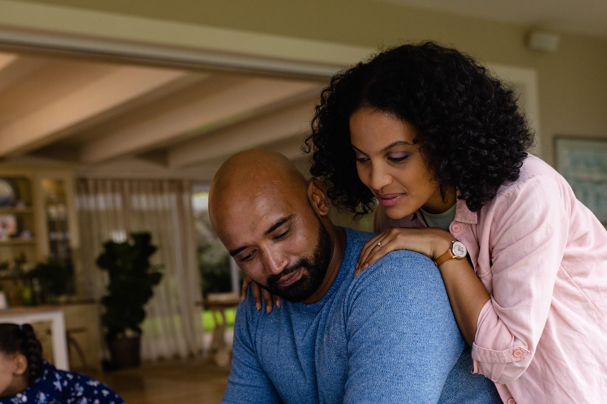 Couple supporting each other at home