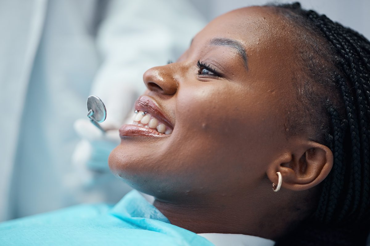Person smiling at a dental checkup